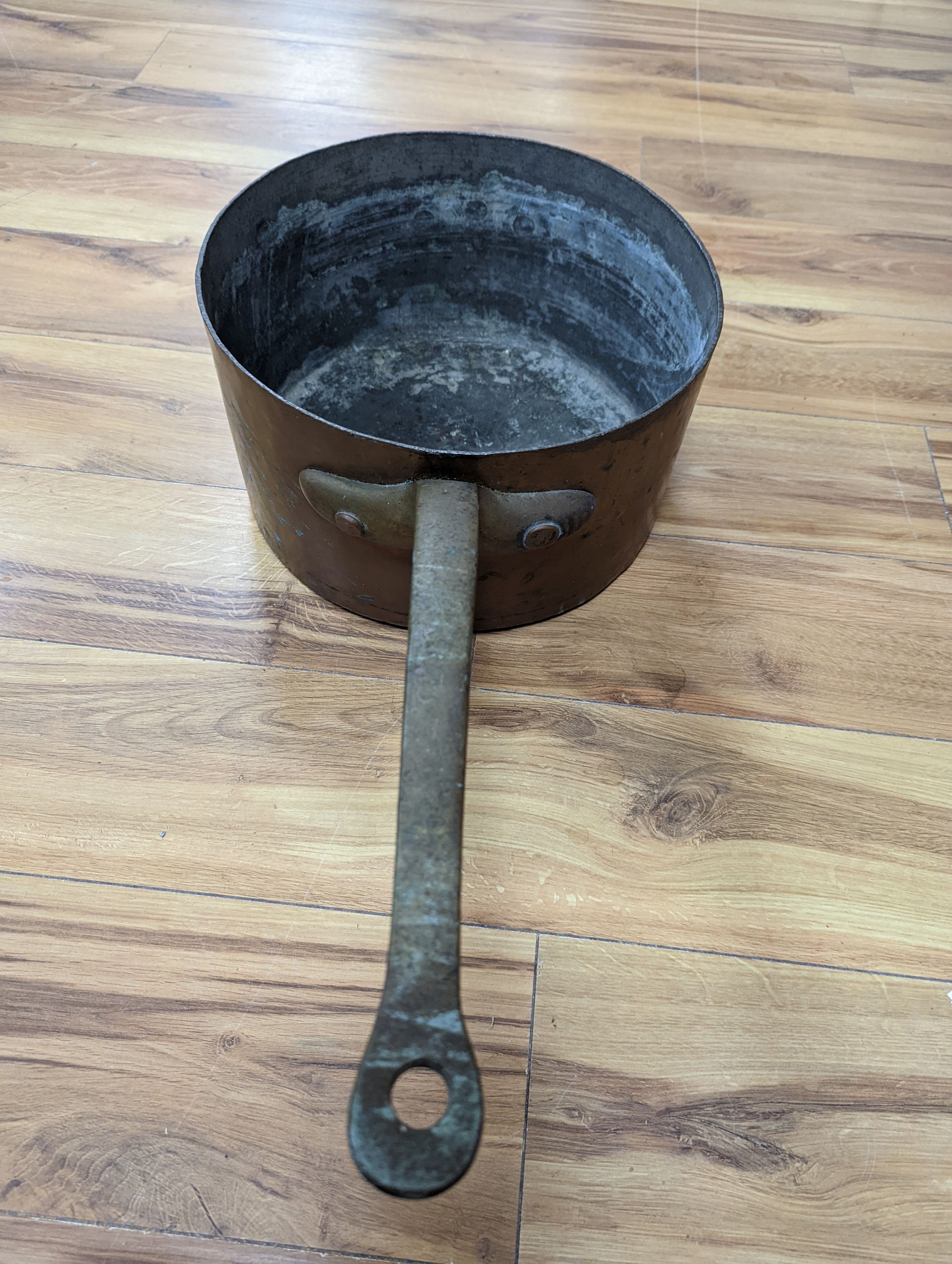 A group of three Jaeggi & Sons copper saucepans